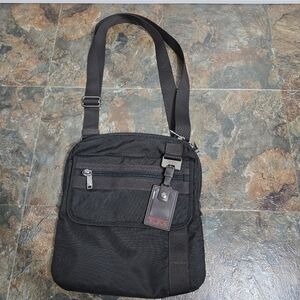 Tumi black and brown zip top flap front crossbody satchel 69304HKO